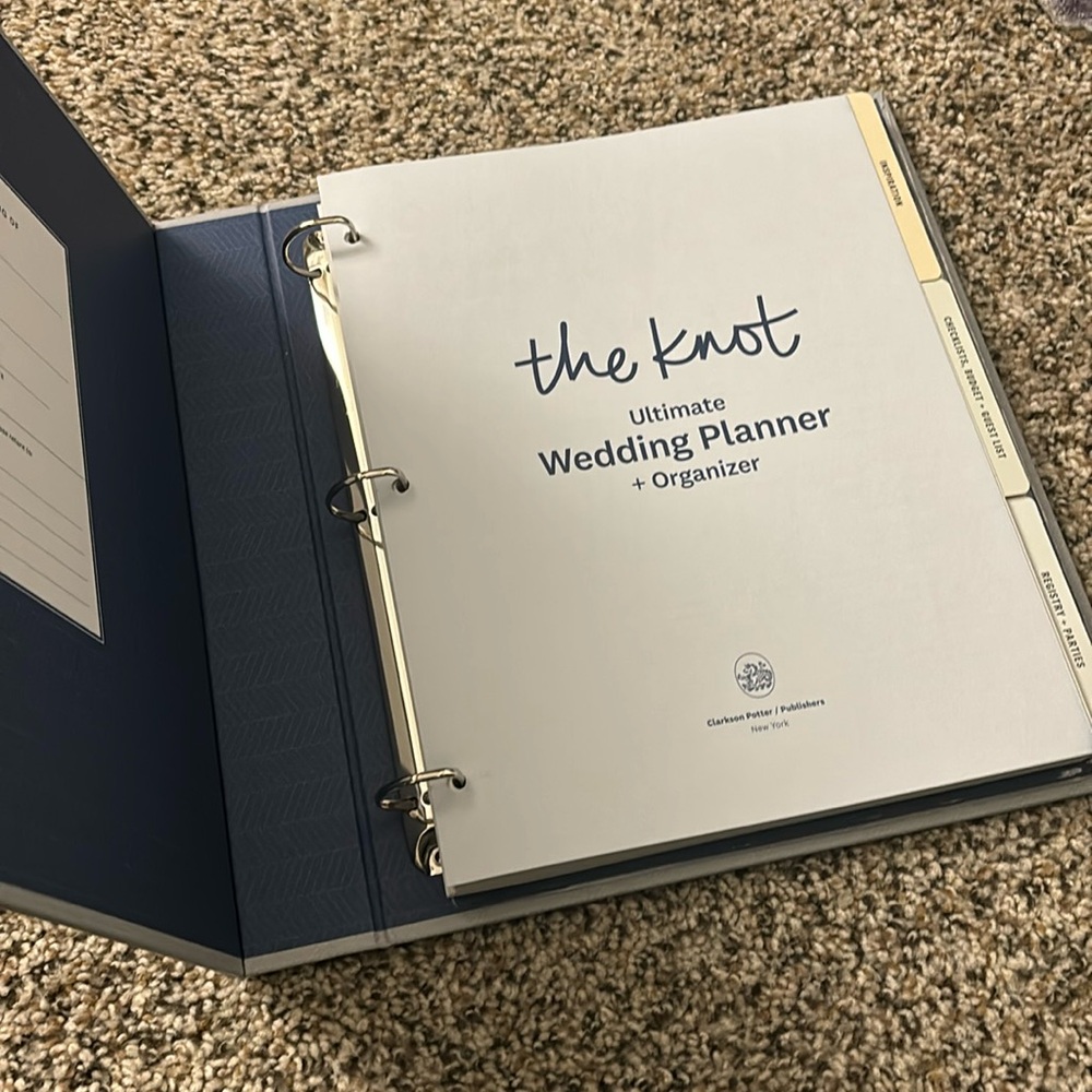 The Knot Ultimate Wedding Planner + Organizer binder. Brand new never used.